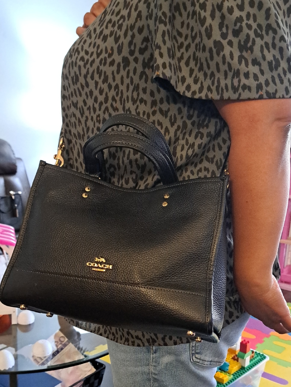 Coach Dempsey Carryall handbag, identified as a black pebble leather